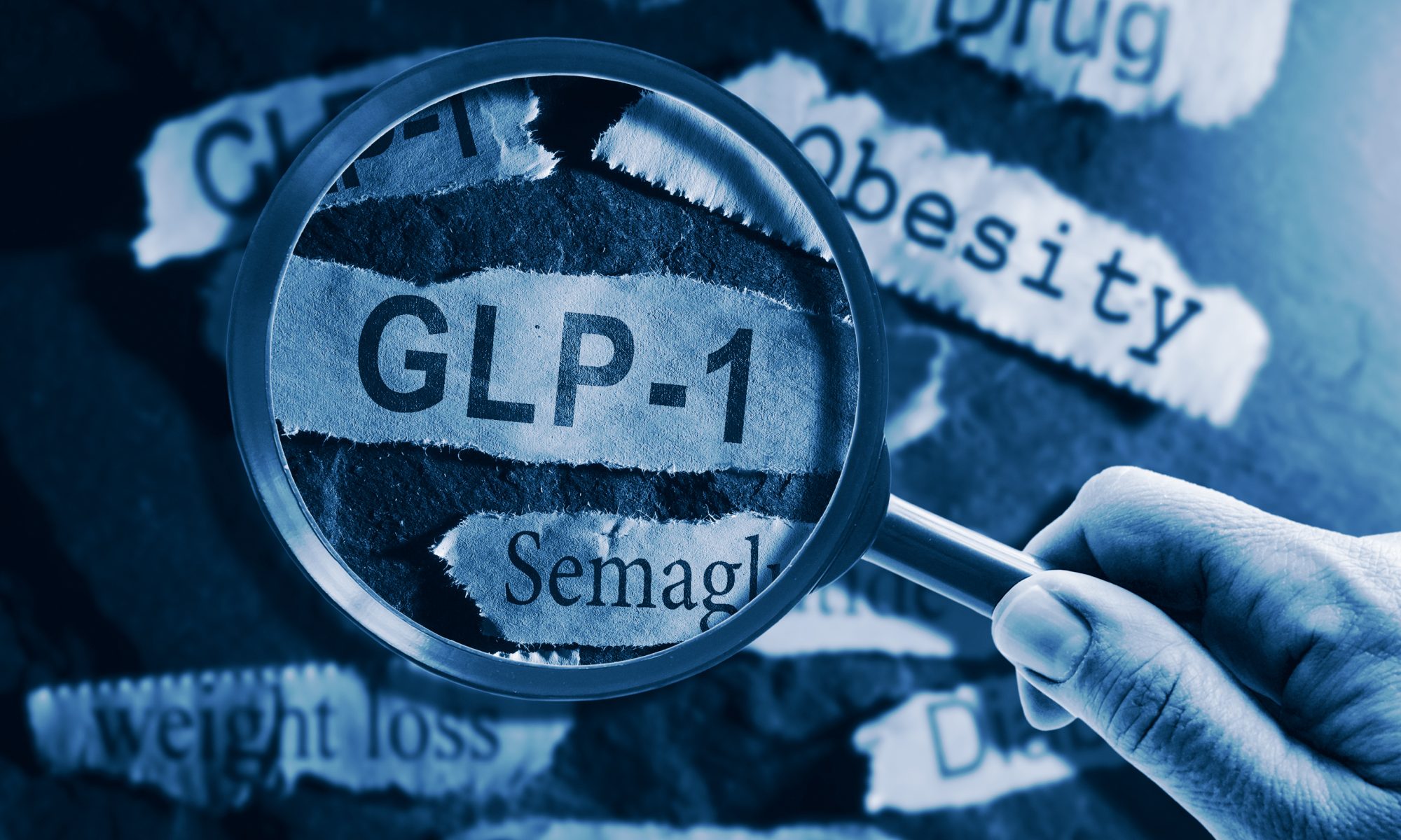 A magnifying glass held over the word “GLP-1” with surrounding text such as “Semaglutide,” “Obesity,” and “weight loss,” representing a medical or pharmaceutical focus.