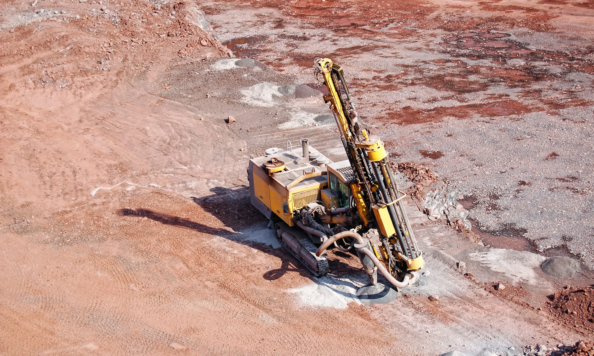 Drilling rig operating at an open-pit mining site as Critical Metals advances exploration at the Tanbreez uranium asset.