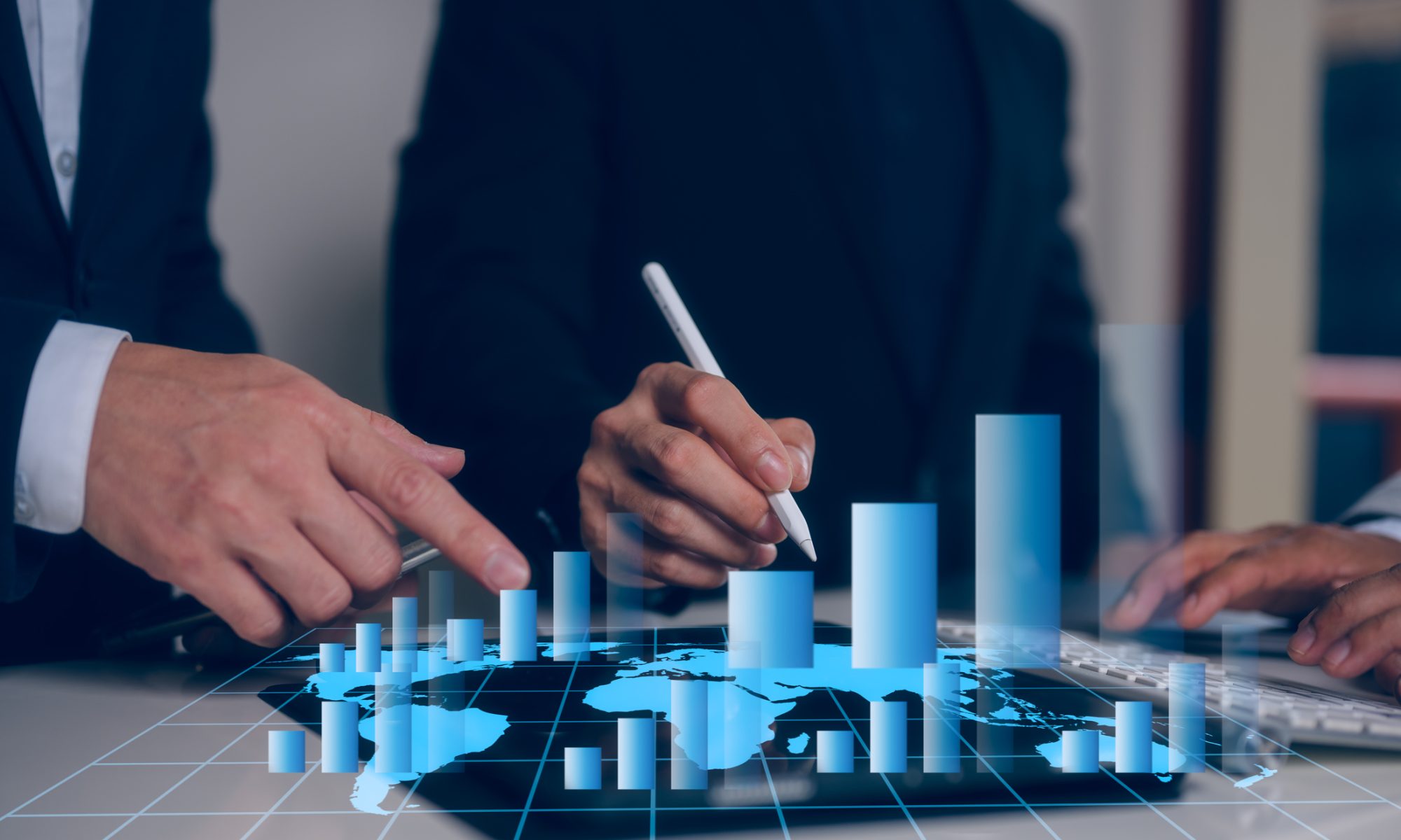 Business professionals analyzing a digital world map with rising bar charts, highlighting gains in next-generation technology, AI, and electric vehicle stocks.