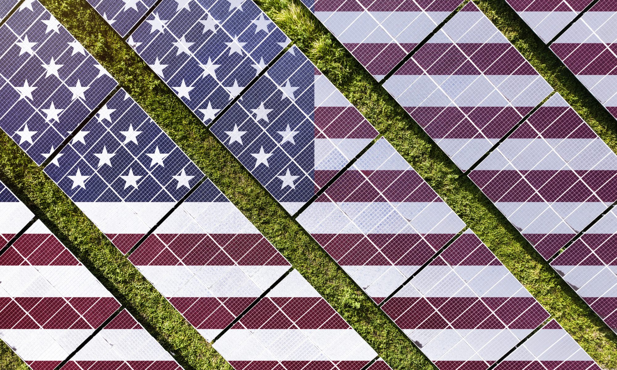 Aerial view of solar panels arranged in rows, designed with the American flag pattern, symbolizing U.S. solar manufacturing and global renewable energy expansion.