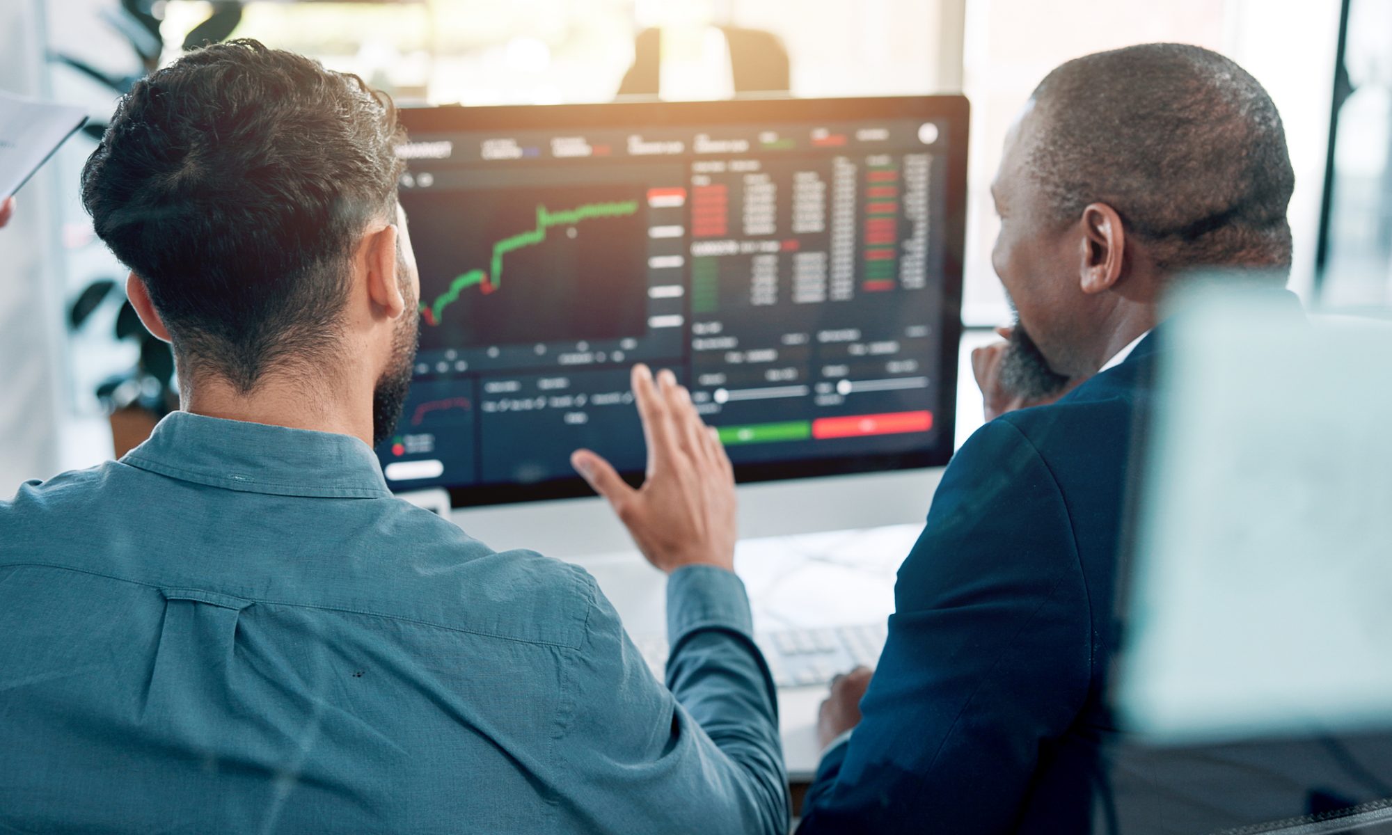Market professionals monitor a rising stock chart, representing active trading in Rare Element Resources, CuriosityStream and other PRISM Mid-Day Movers.