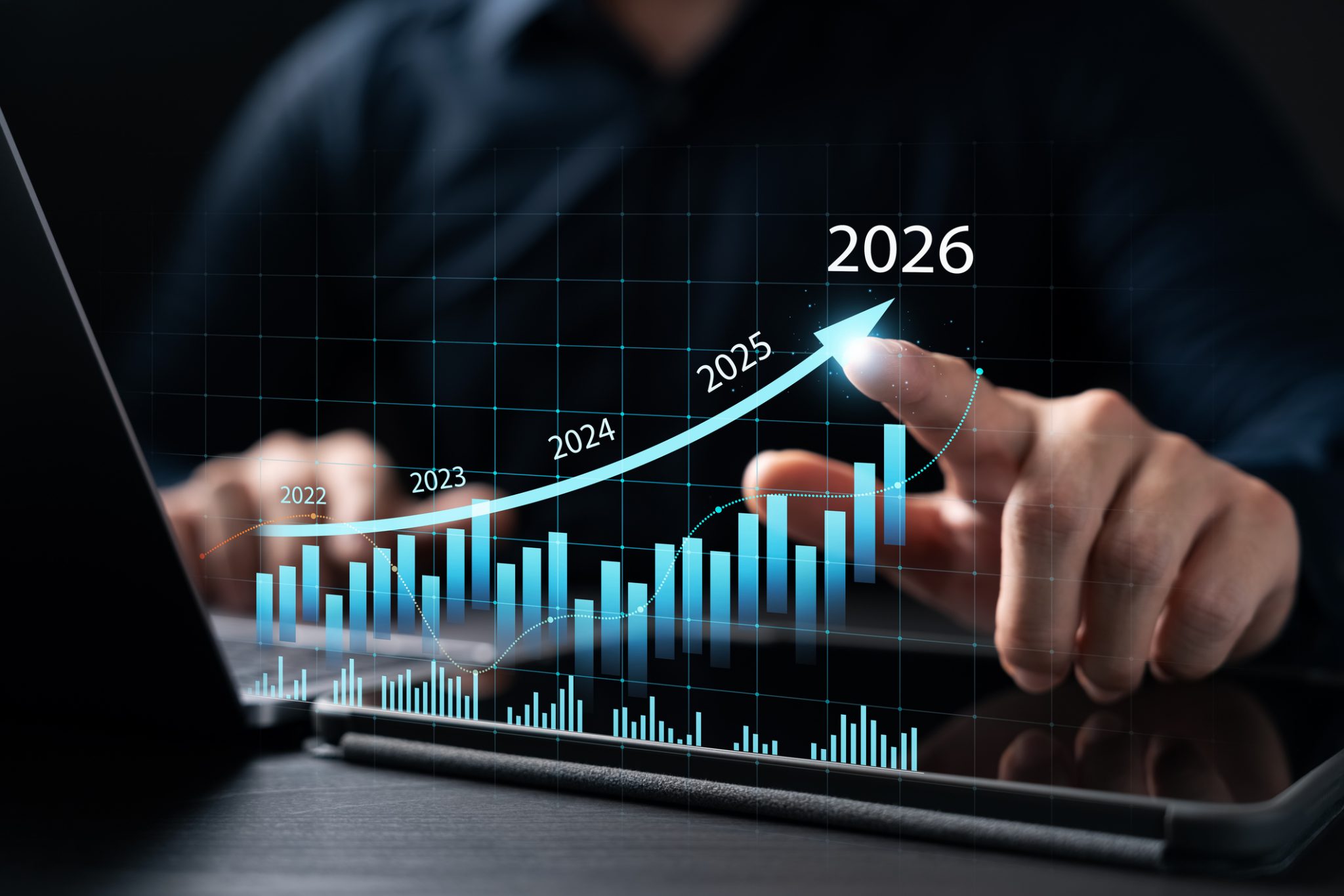 Business professional interacting with a digital growth chart showing an upward trajectory toward 2026, representing Roadzen’s record revenue growth and improving operating performance.
