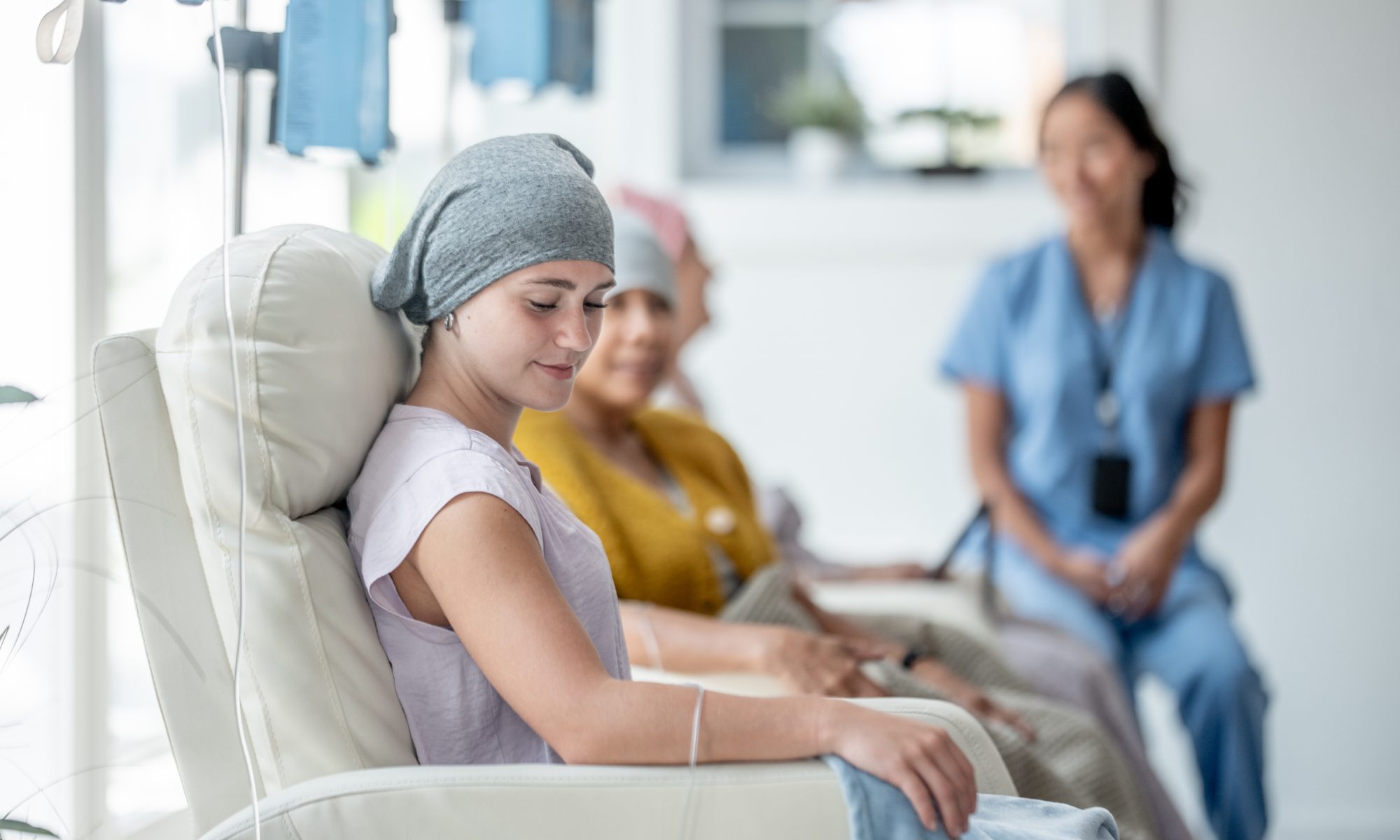 Cancer patients receiving infusion treatment in an oncology clinic, representing clinical research and new therapies for advanced endometrial cancer.