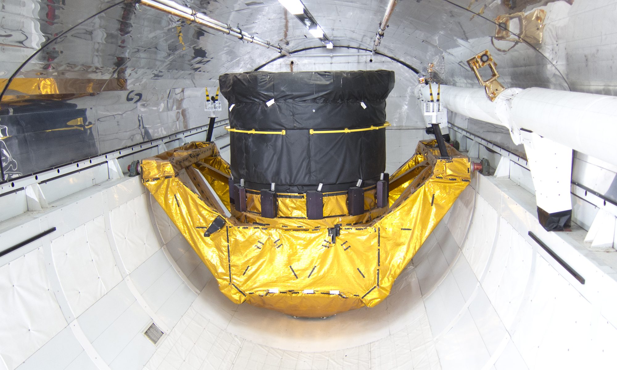 Spacecraft payload undergoing prelaunch processing inside a specialized aerospace facility, representing Firefly Aerospace’s eligibility to compete for NASA payload-processing work at Vandenberg Space Force Base.