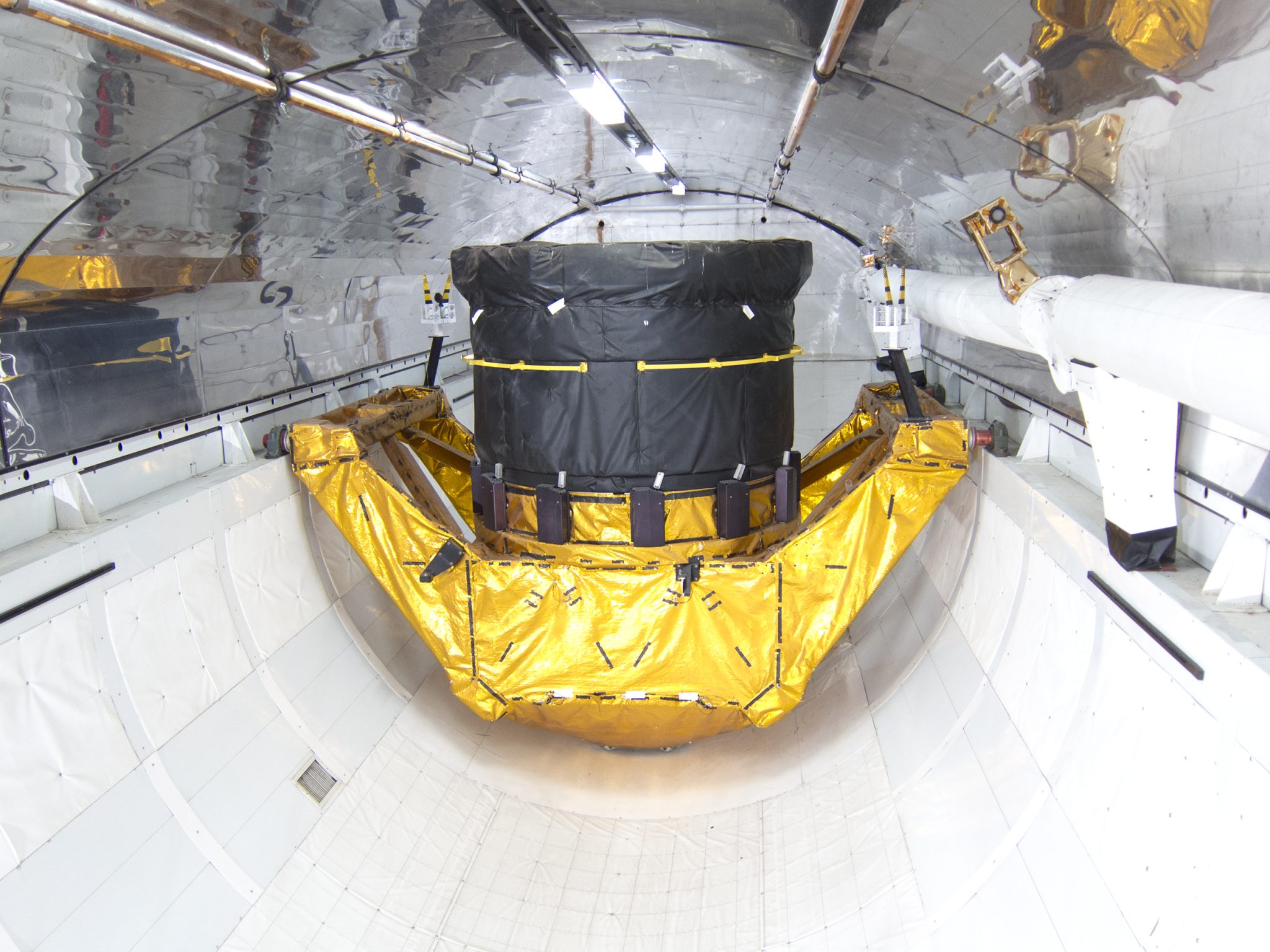 Spacecraft payload undergoing prelaunch processing inside a specialized aerospace facility, representing Firefly Aerospace’s eligibility to compete for NASA payload-processing work at Vandenberg Space Force Base.