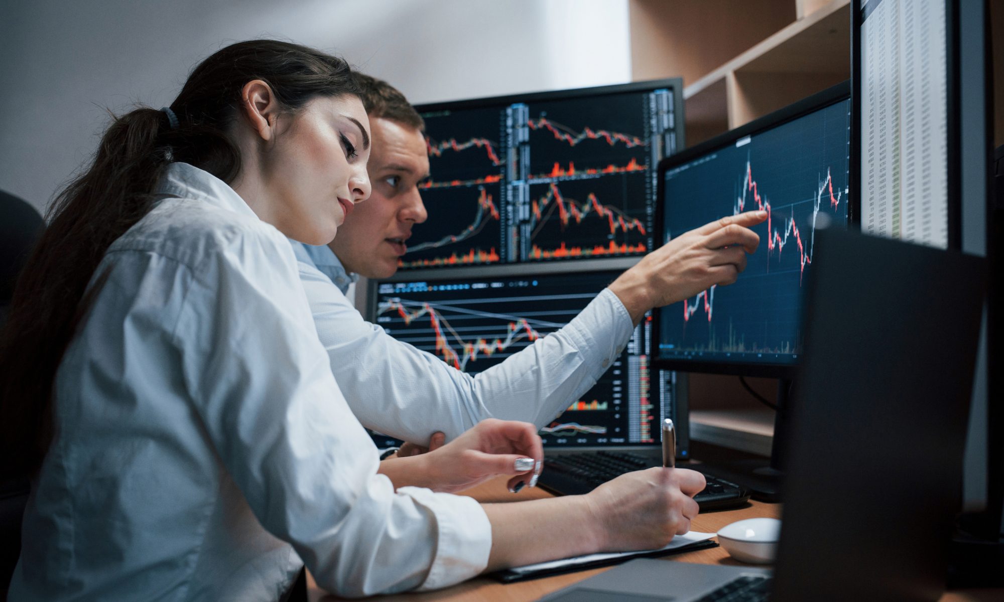 Market analysts monitor stock charts during a volatile trading session as NextGen Tech & AI and Mental Health stocks lead PRISM’s mid-day movers.