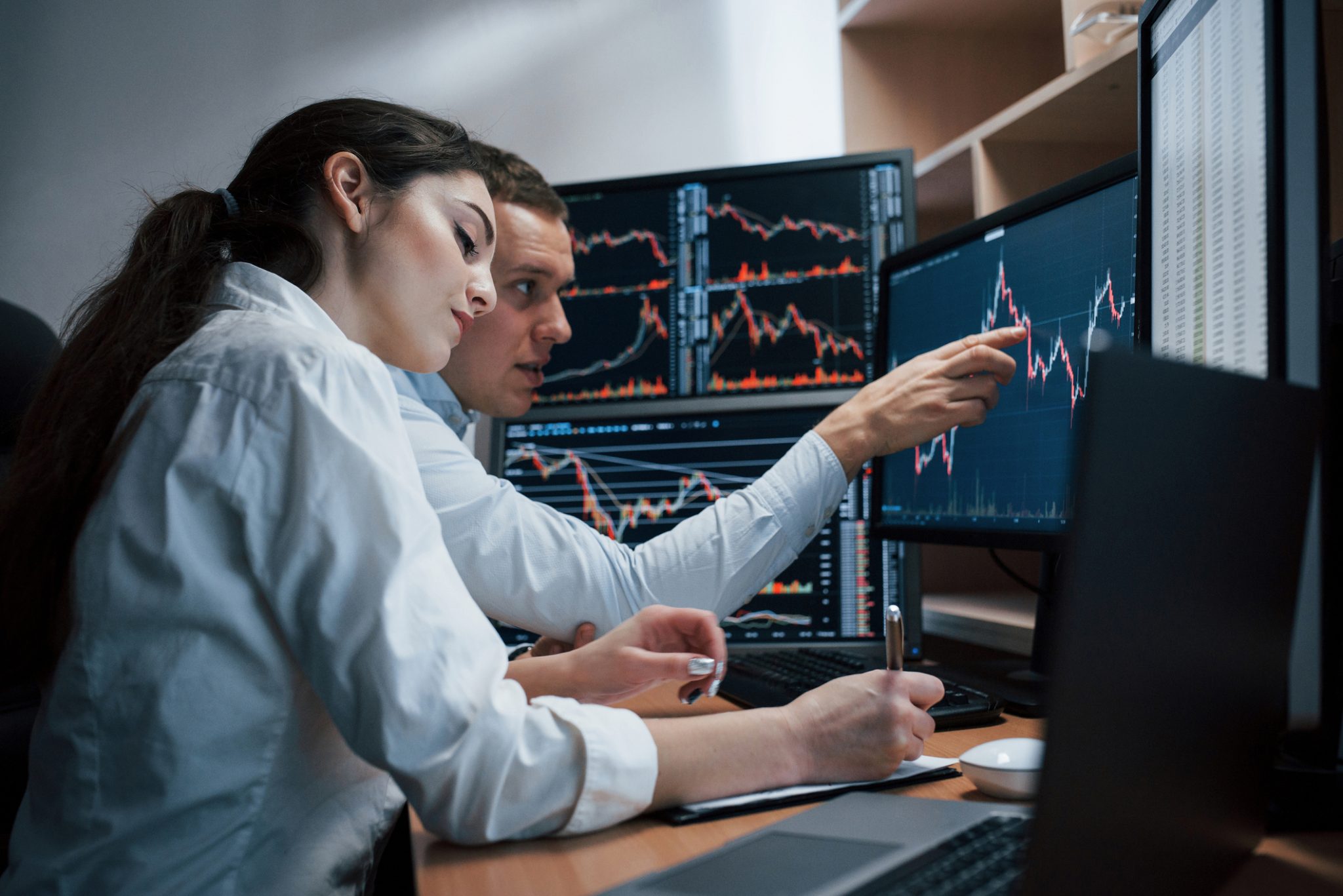 Market analysts monitor stock charts during a volatile trading session as NextGen Tech & AI and Mental Health stocks lead PRISM’s mid-day movers.