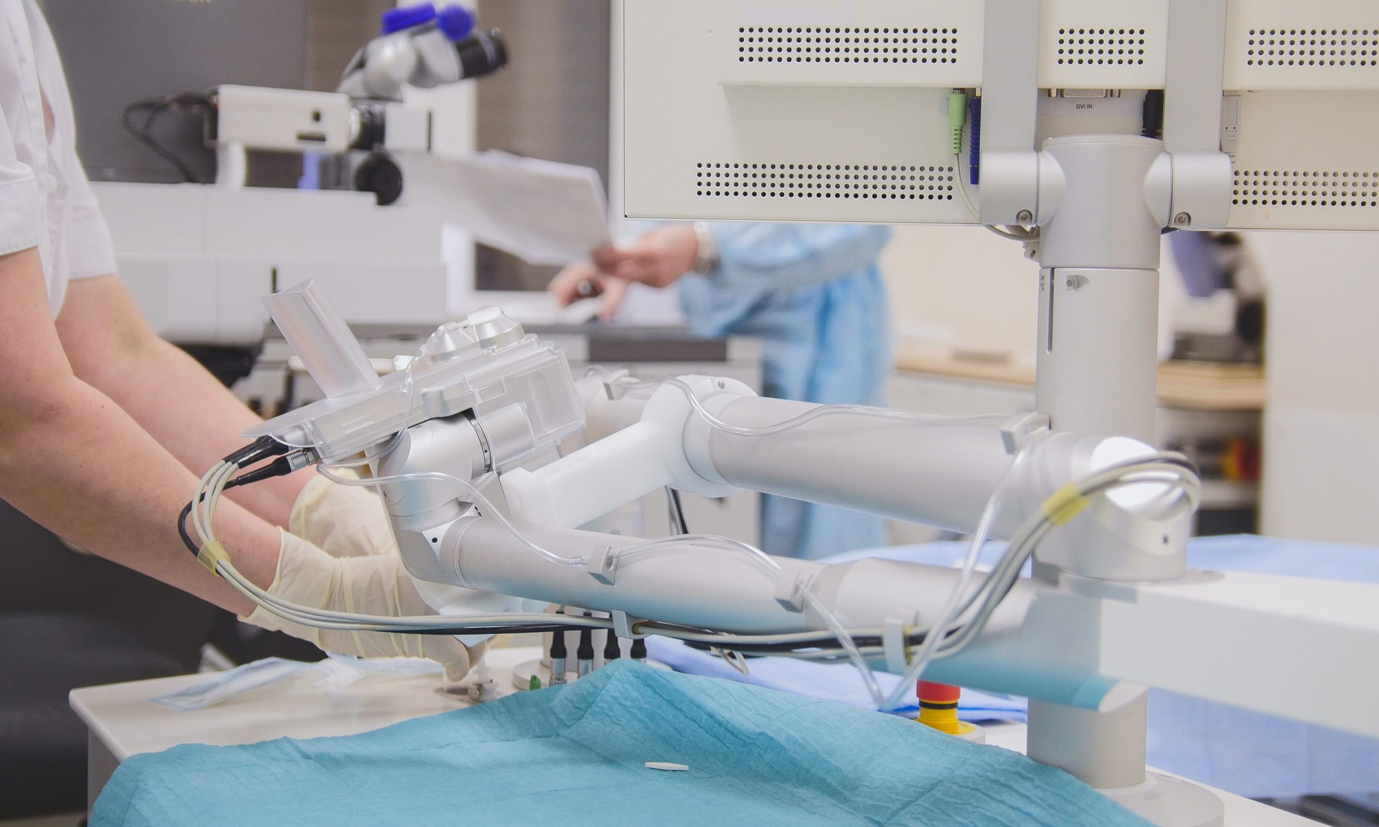 Robotic medical equipment assists with a precision laboratory procedure, representing NeuroOne’s StereoCED platform for targeted brain drug delivery and electrophysiological recording.