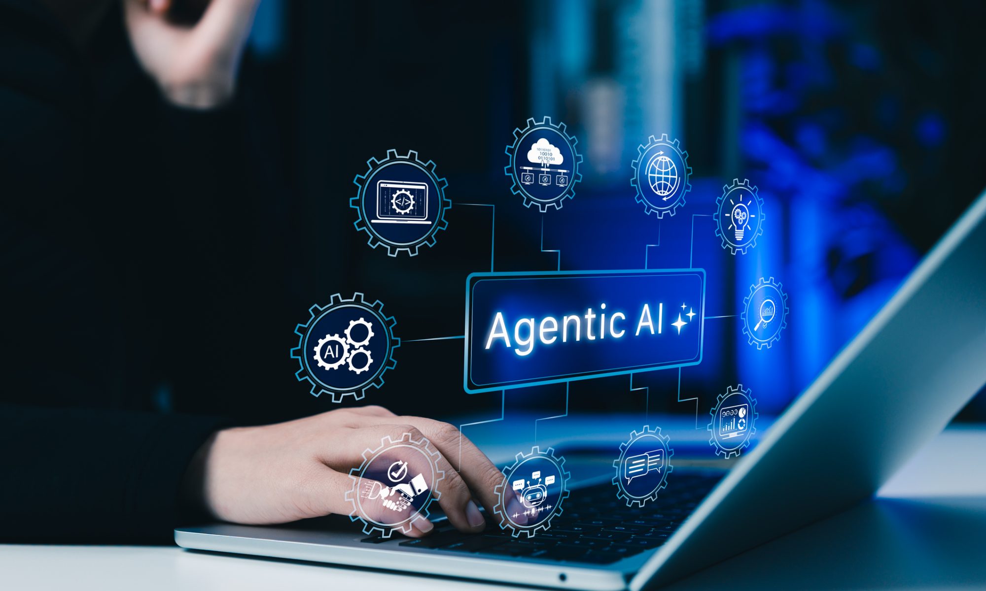 Person using a laptop with an Agentic AI interface and connected digital automation icons, representing Rezolve AI and Tech Mahindra’s partnership to expand AI-powered commerce for global enterprises.