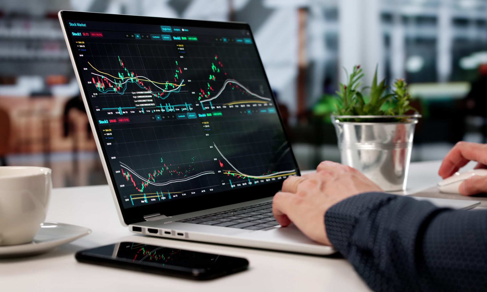 Investor monitoring stock charts on a laptop, representing active midday trading in PRISM MarketView’s Women’s Health and New Energy sectors.