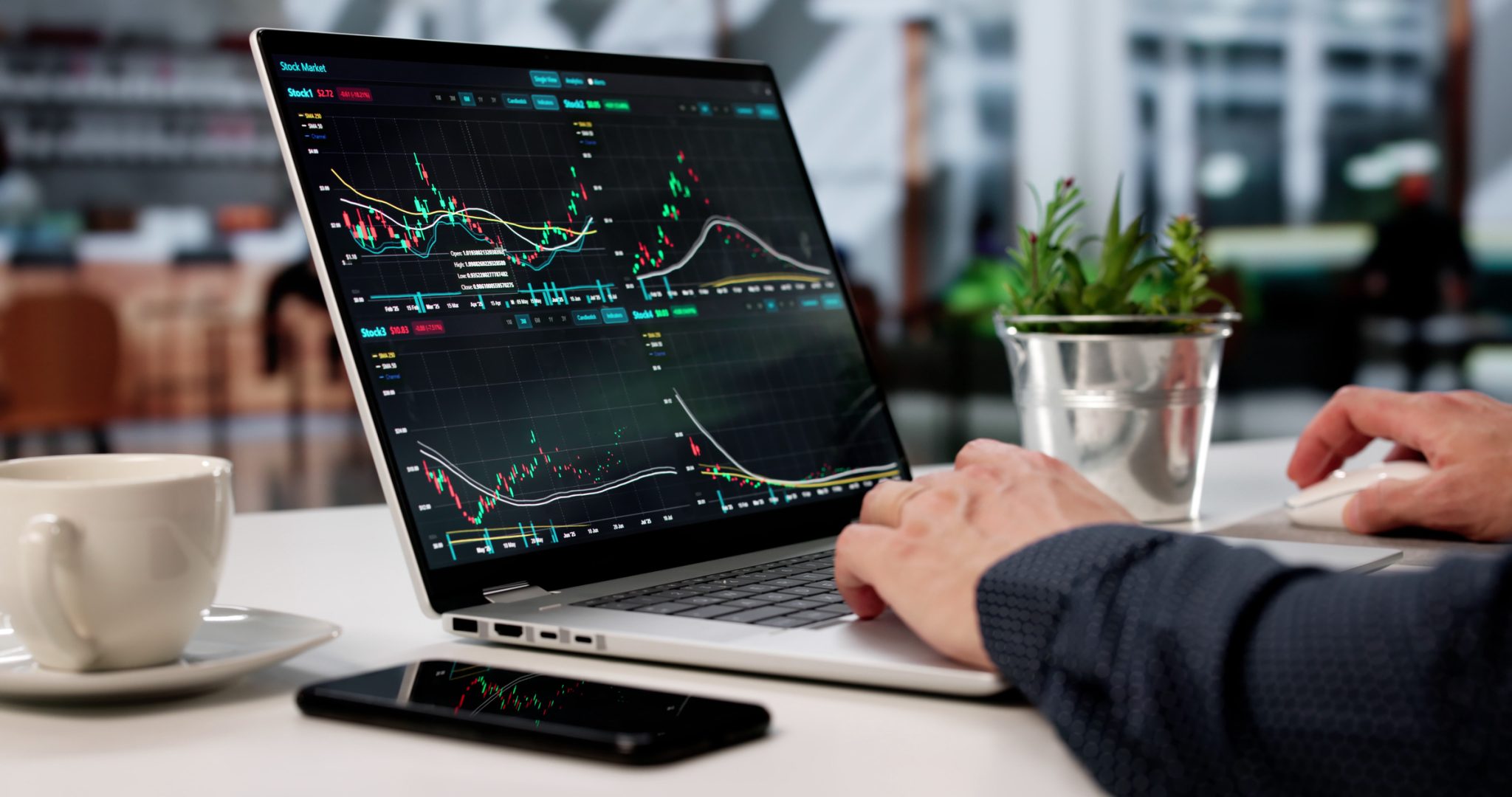 Investor monitoring stock charts on a laptop, representing active midday trading in PRISM MarketView’s Women’s Health and New Energy sectors.