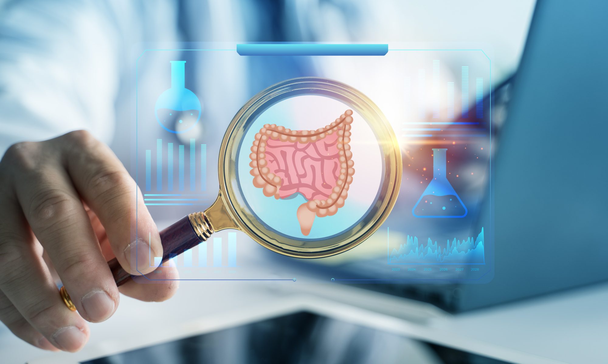 Medical researcher examines an illustration of the digestive tract, representing colorectal cancer research and development of new combination therapies.