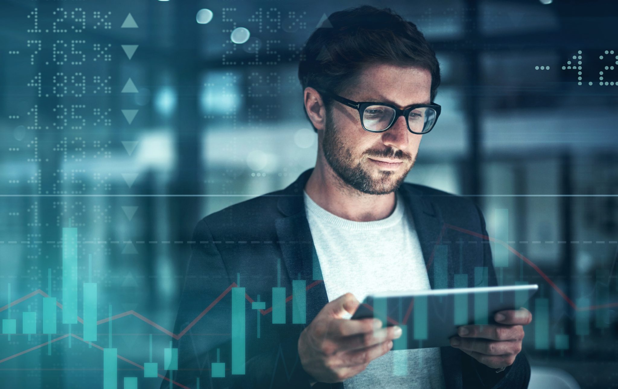 Investor reviewing market data on a tablet with stock charts in the background, representing active trading in crypto mining and cybersecurity stocks.