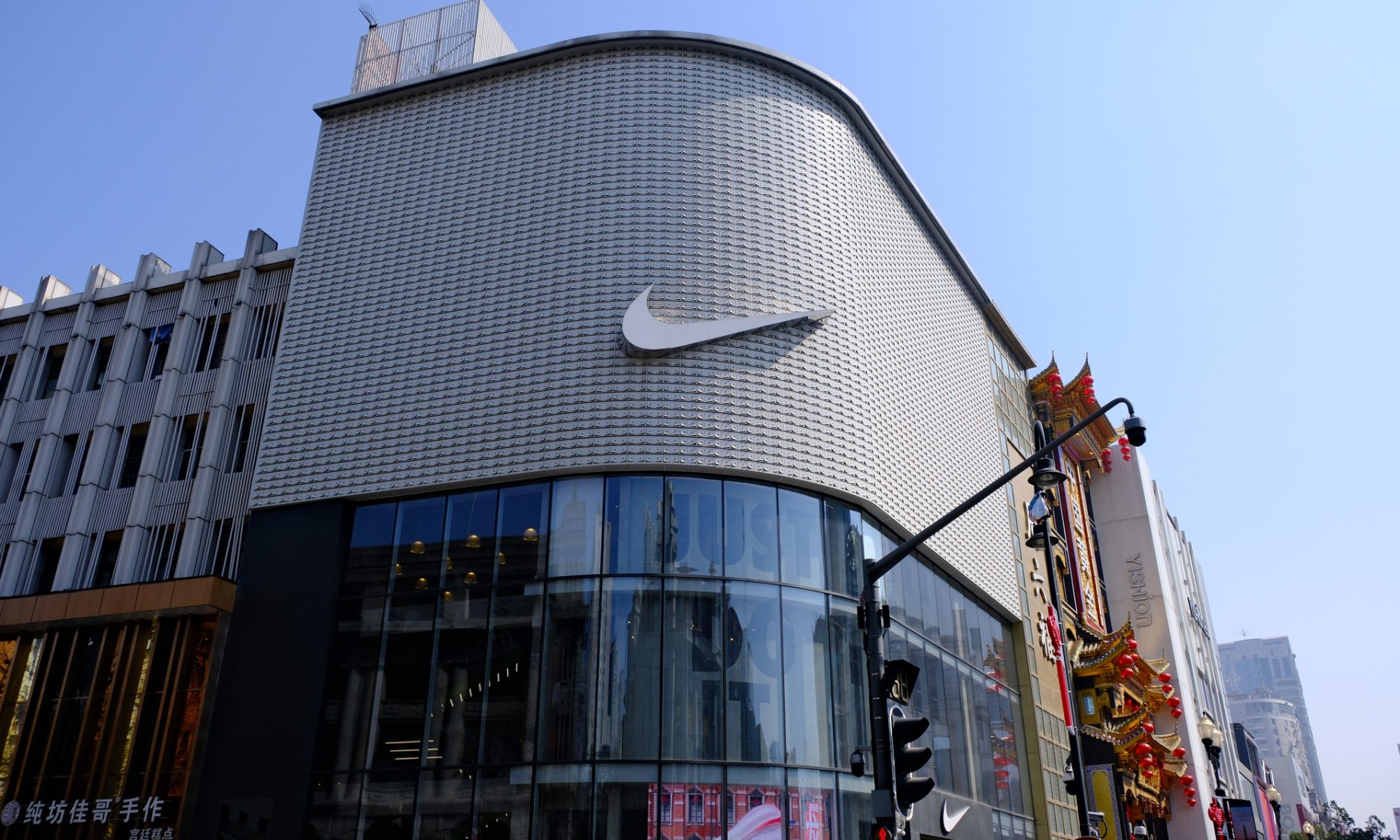 Nike missed on Q1 revenue, guided fiscal 2027 sales down high single digits, and launched a second restructuring. China fell 22%. NKE hit a new 52-week low.