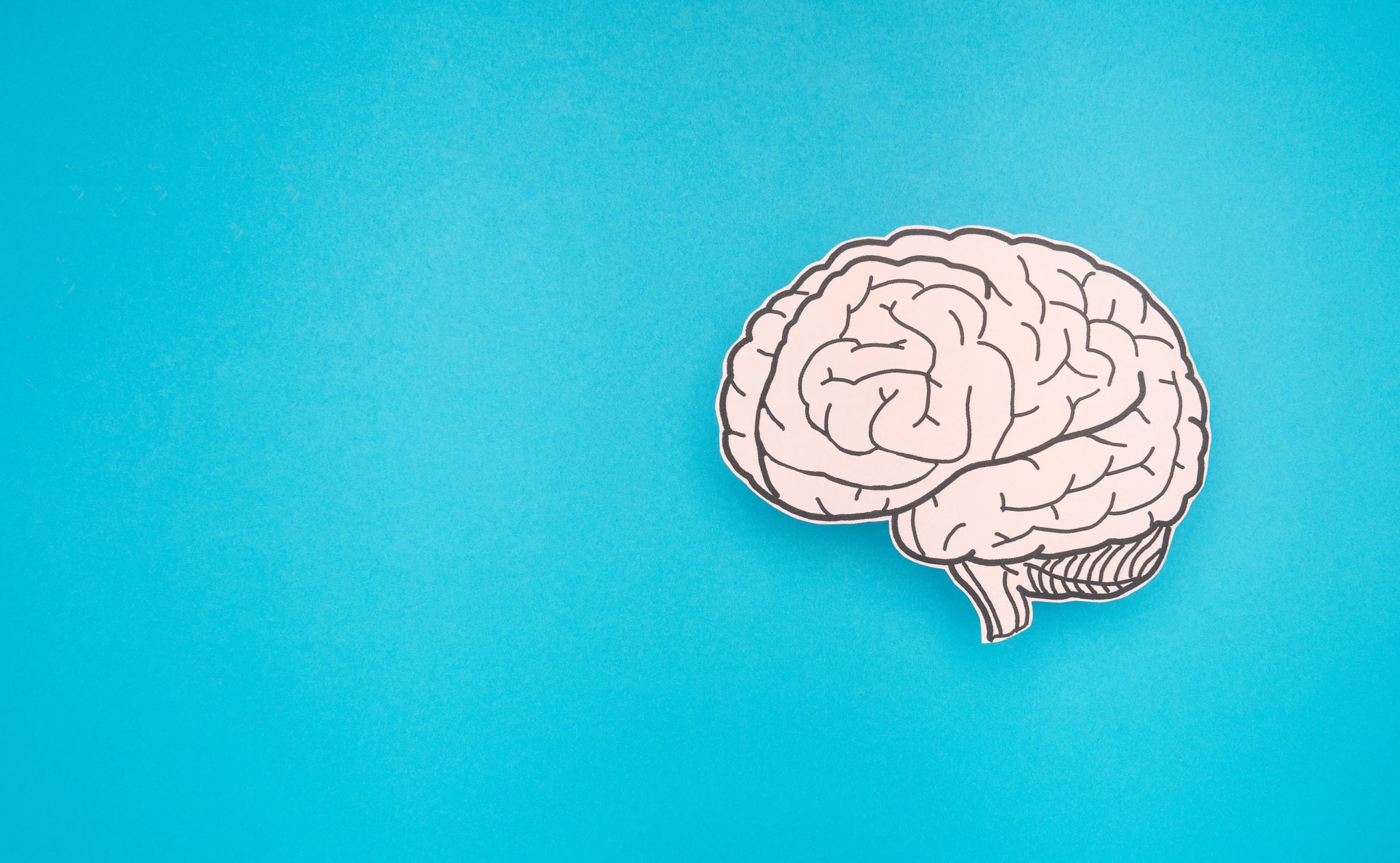 Illustration of a human brain against a turquoise background, representing Alzheimer’s disease research and emerging therapies targeting tau protein.